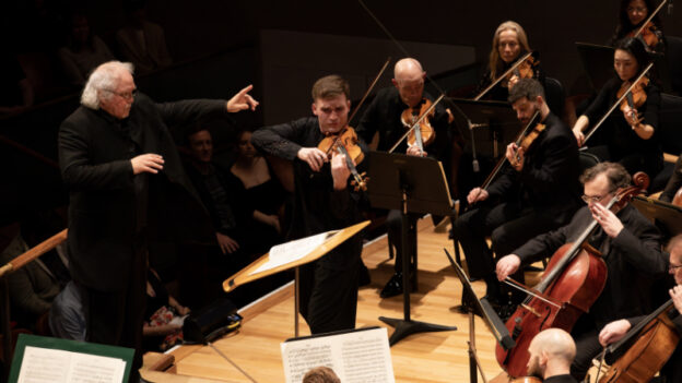 Donald Runnicles, conductor, and Alexi Kenney, violin solo, with the Dallas Symphony Orchestra performing Sibelius' "Violin Concerto" at the Meyerson Symphony Center, February 1, 2024. (credit: Dallas Symphony Orchestra/Sylvia Elzafon)