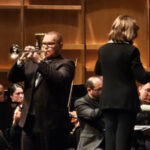 Trumpeter Alex Wilborn solos in with the Charlotte Symphony and conductor JoAnn Falletta. (courtesy of Charlotte Symphony)
