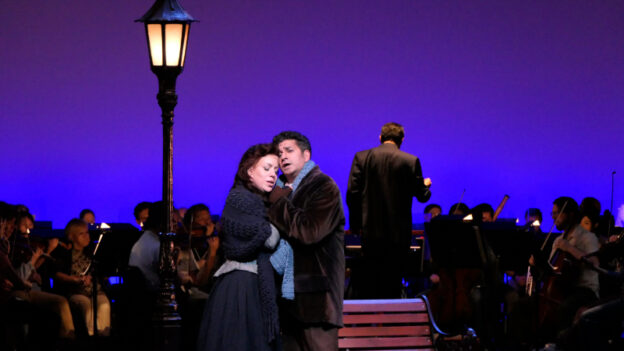 Elizabeth Caballero and Alok Kumar as Mimi and Rodolfo, with conductor Miguel Harth-Bedoya and the Fort Worth Symphony Orchestra in the Fort Worth Opera's semi-staged performance of “La bohème.” (credit: Freddie Watkins)