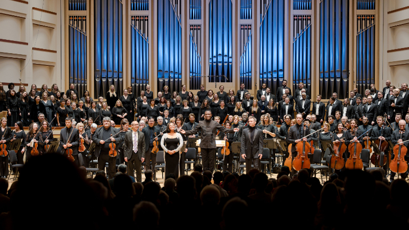 L-R, front: Kenney Potter, Janai Brugger, Kwamé Ryan, and Alexander Birch Elliott take a bow with the Charlotte Symphony Orchestra and Charlotte Master Chorale. (courtesy of Charlotte Symphony Orchestra)