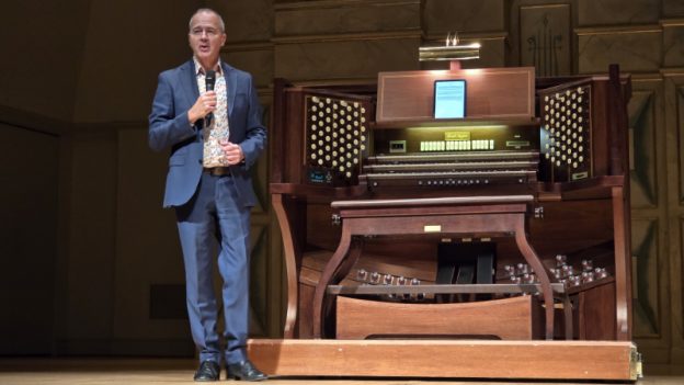 Alan Morrison at Spivey Hall alongside the console of its Albert Schweitzer Memorial Organ, built by Fratelli Ruffatti of Padua, Italy. (credit: William Ford)