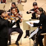 Violinist Joshua Bell solos with the Boston Symphony Orchestra led by associate conductor Anna Handler. (credit: Winslow Townson)