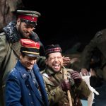 Matthew Worth, in blue uniform, as French Lt. Audebert, Craig Irvin, in back, as German Lt. Horstmayer, and Alexander Hajek as Lt. Gordon, the Scottish lieutenant, in a 2016 production of Kevin Puts’ ‘Silent Night’ at The Atlanta Opera. (credit: Jeff Roffman)