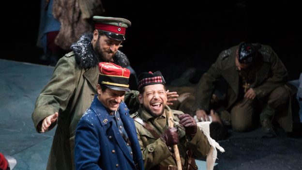 Matthew Worth, in blue uniform, as French Lt. Audebert, Craig Irvin, in back, as German Lt. Horstmayer, and Alexander Hajek as Lt. Gordon, the Scottish lieutenant, in a 2016 production of Kevin Puts’ ‘Silent Night’ at The Atlanta Opera. (credit: Jeff Roffman)