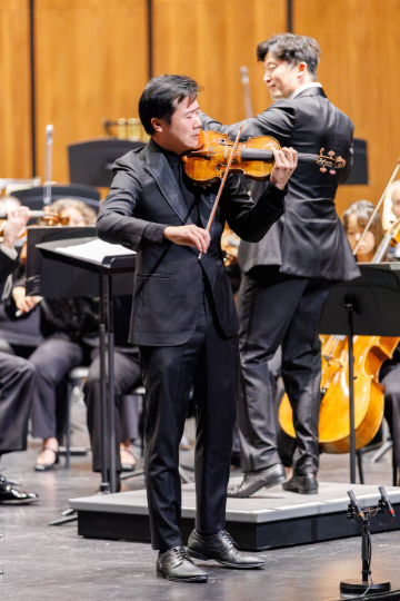 Violinist Simon Zhu and JCSO music director Henry Cheng. (credit: Ken Otloff)