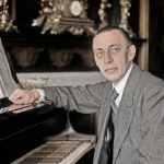 Sergei Rachmaninoff at a Steinway grand piano,1915. (Historical photo, gently colorized by Grok/xAI)
