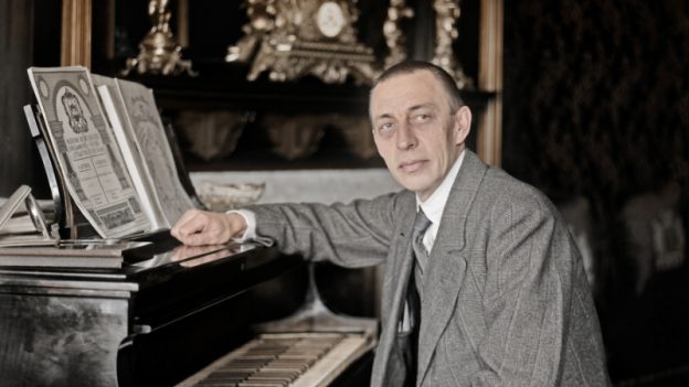 Sergei Rachmaninoff at a Steinway grand piano,1915. (Historical photo, gently colorized by Grok/xAI)